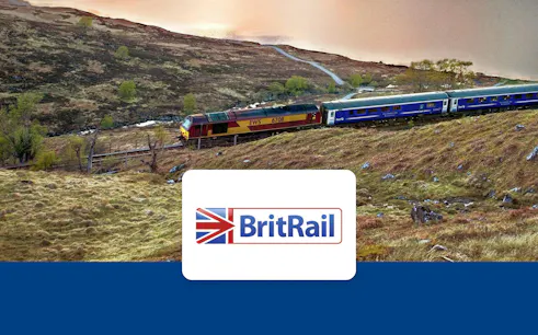 Train traveling through scenic British countryside with BritRail logo.