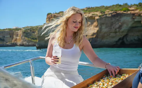 Brunch on a boat with scenic cliffs during Ponta da Piedade cruise from Lagos.