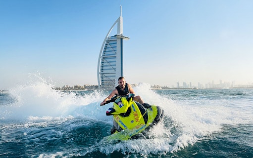 Tourist on jet ski near Burj Al Arab in Dubai.