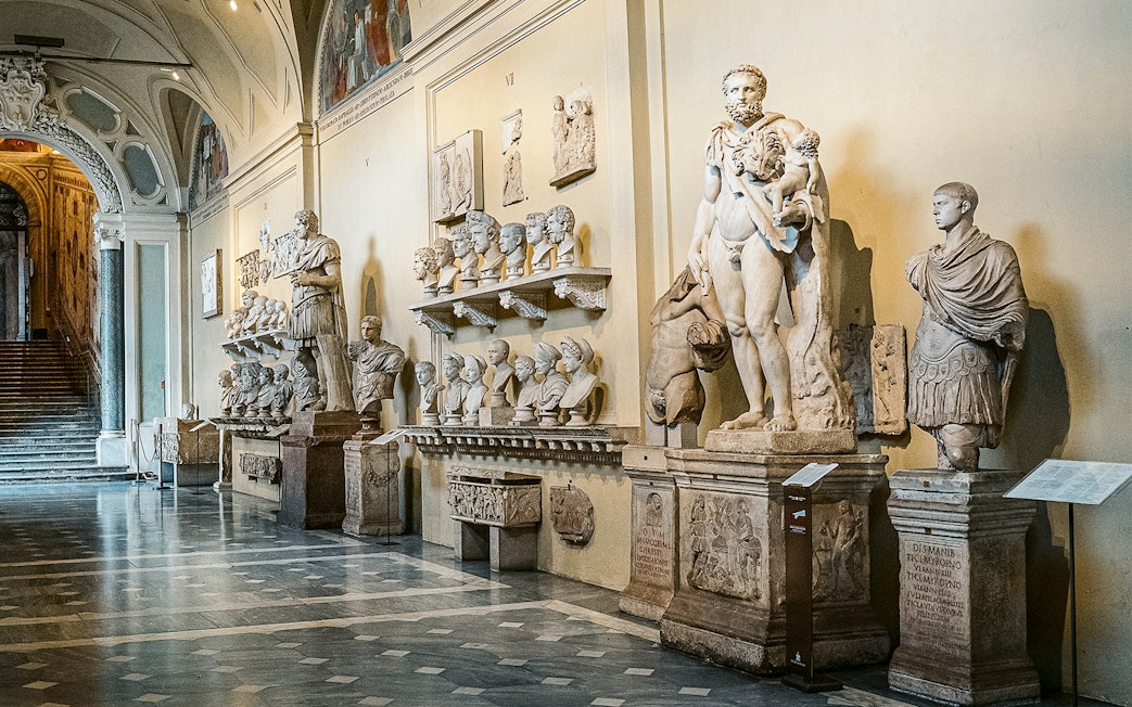 Vatican Museums sculptures and busts in a gallery on the Sistine Chapel small group tour.