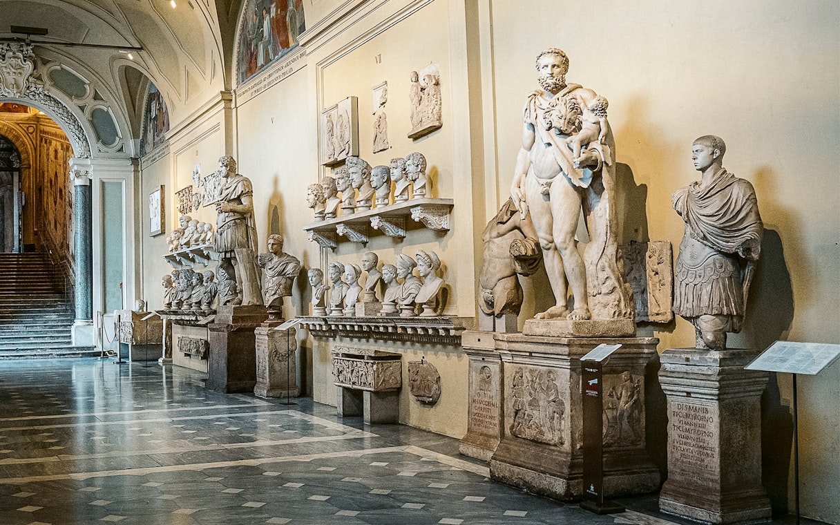 Vatican Museums sculptures and busts in a gallery on the Sistine Chapel small group tour.