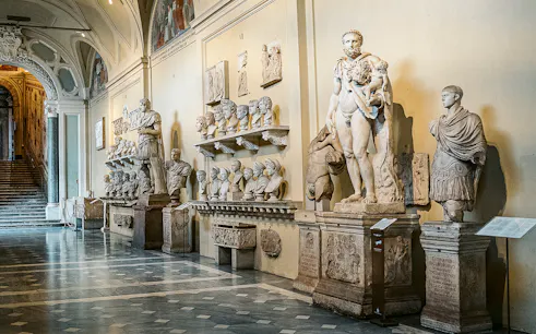 Vatican Museums sculptures and busts in a gallery on the Sistine Chapel small group tour.