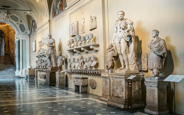 Vatican Museums sculptures and busts in a gallery on the Sistine Chapel small group tour.