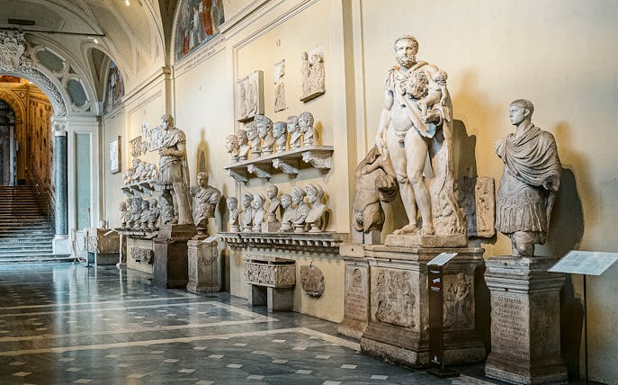 Vatican Museums sculptures and busts in a gallery on the Sistine Chapel small group tour.