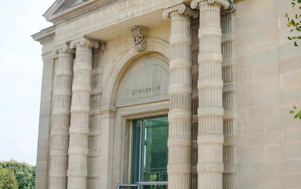 Entrance of Musée de l’Orangerie in Paris with classical columns.