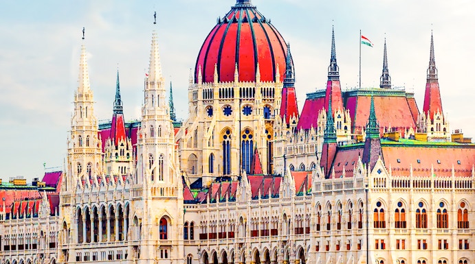 Hungarian Parliament building with reflection on the Danube River in Budapest.
