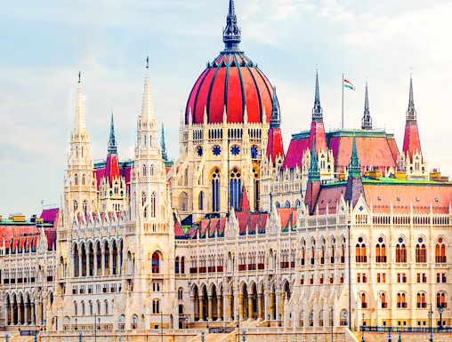 Hungarian Parliament building with reflection on the Danube River in Budapest.
