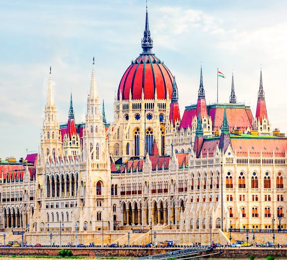 Hungarian Parliament building with reflection on the Danube River in Budapest.