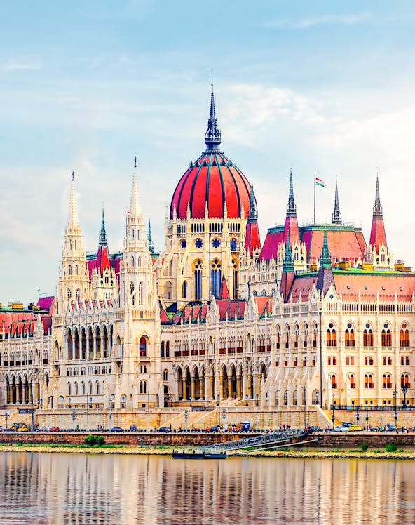 Hungarian Parliament building with reflection on the Danube River in Budapest.