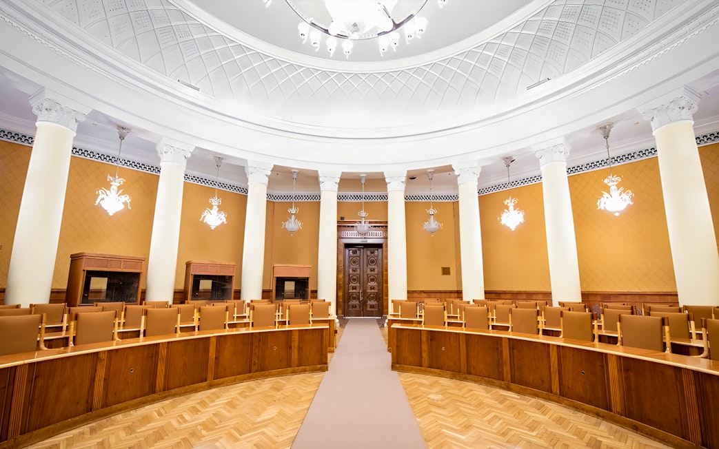 Interior of a conference room with columns and ornate ceiling at the Palace of Culture and Science.