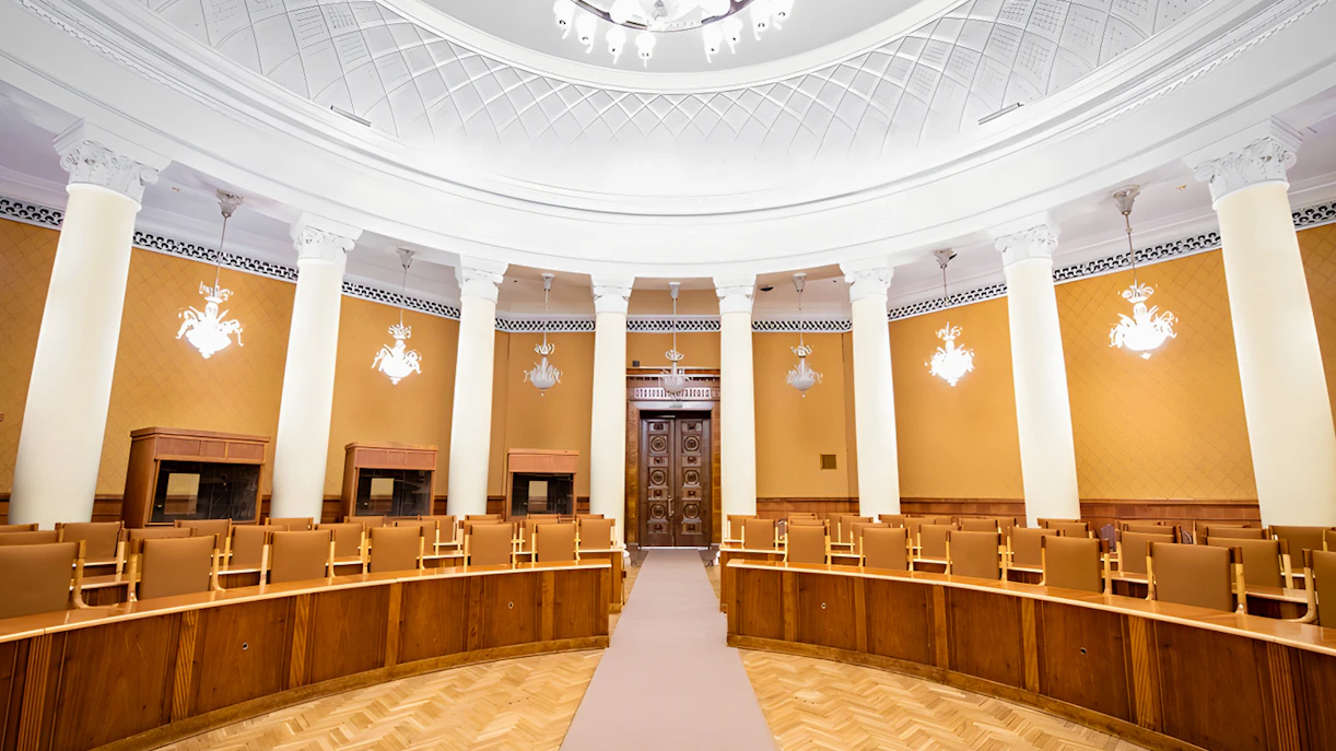Interior of a conference room with columns and ornate ceiling at the Palace of Culture and Science.