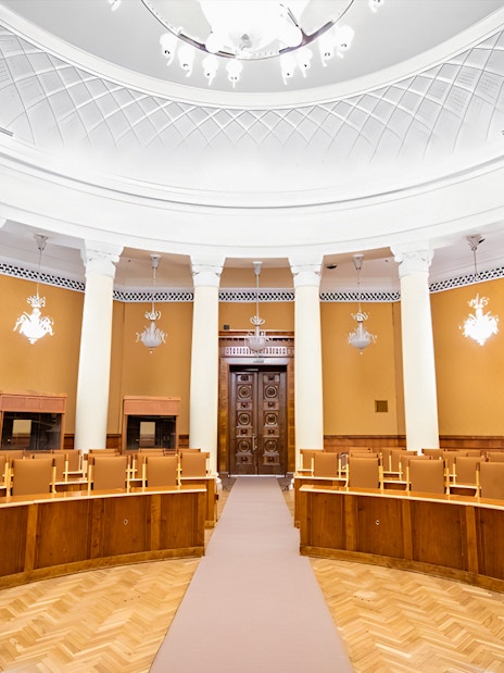 Interior of a conference room with columns and ornate ceiling at the Palace of Culture and Science.