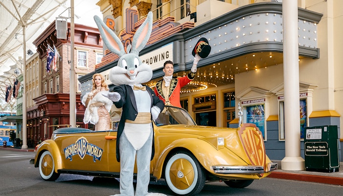 Warner Bros. Movie World entrance with iconic archway and themed characters, Gold Coast, Australia.