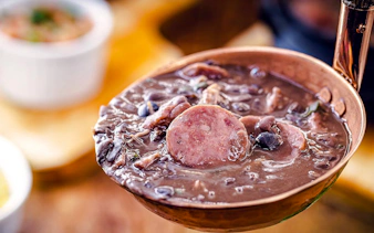 Feijoada dish with sausage and beans on Rio de Janeiro food tour.