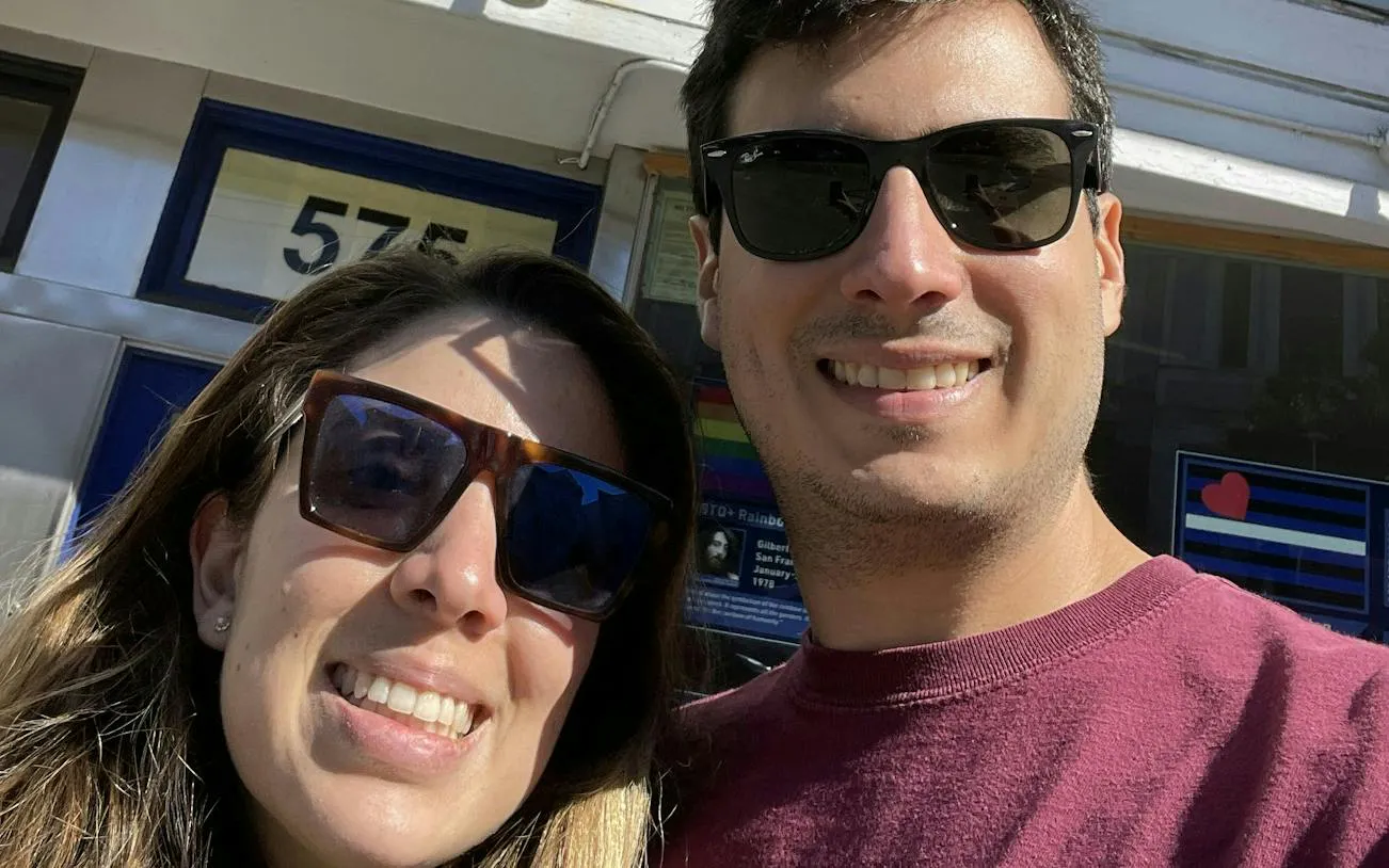 Selfie of two people in front of a building in Castro District, San Francisco.