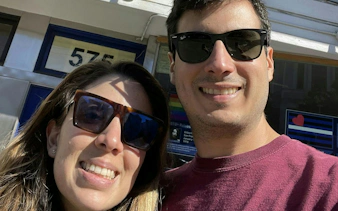 Selfie of two people in front of a building in Castro District, San Francisco.