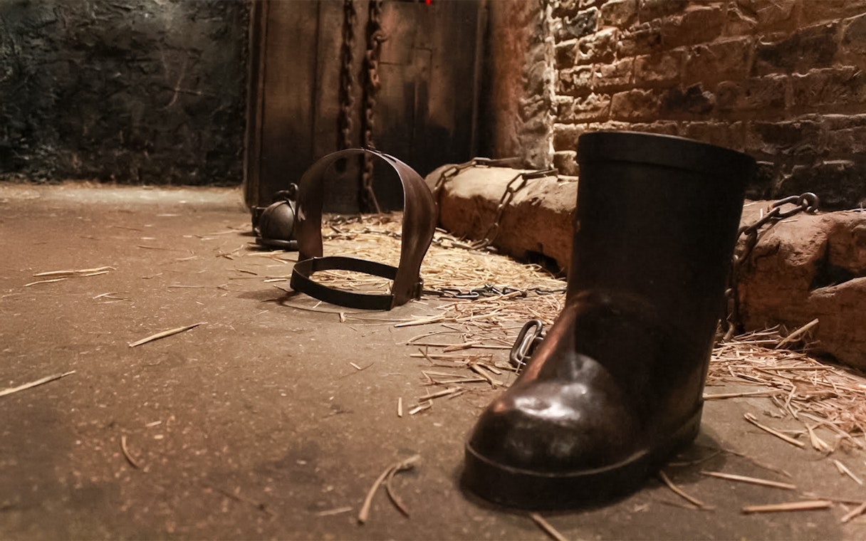 Chains and shackles on the floor of The Clink Prison Museum, London.