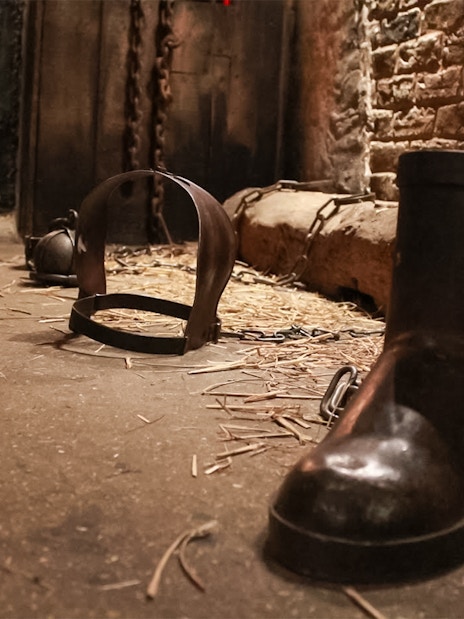 Chains and shackles on the floor of The Clink Prison Museum, London.