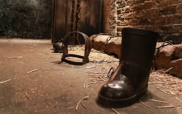 Chains and shackles on the floor of The Clink Prison Museum, London.