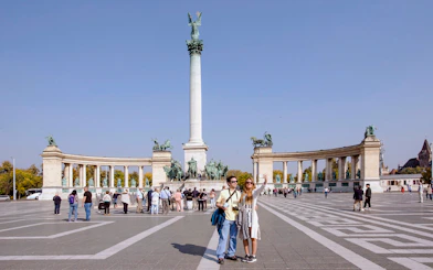 Tourists at Heroes' Square with Millennium Monument, Budapest, Hungary.