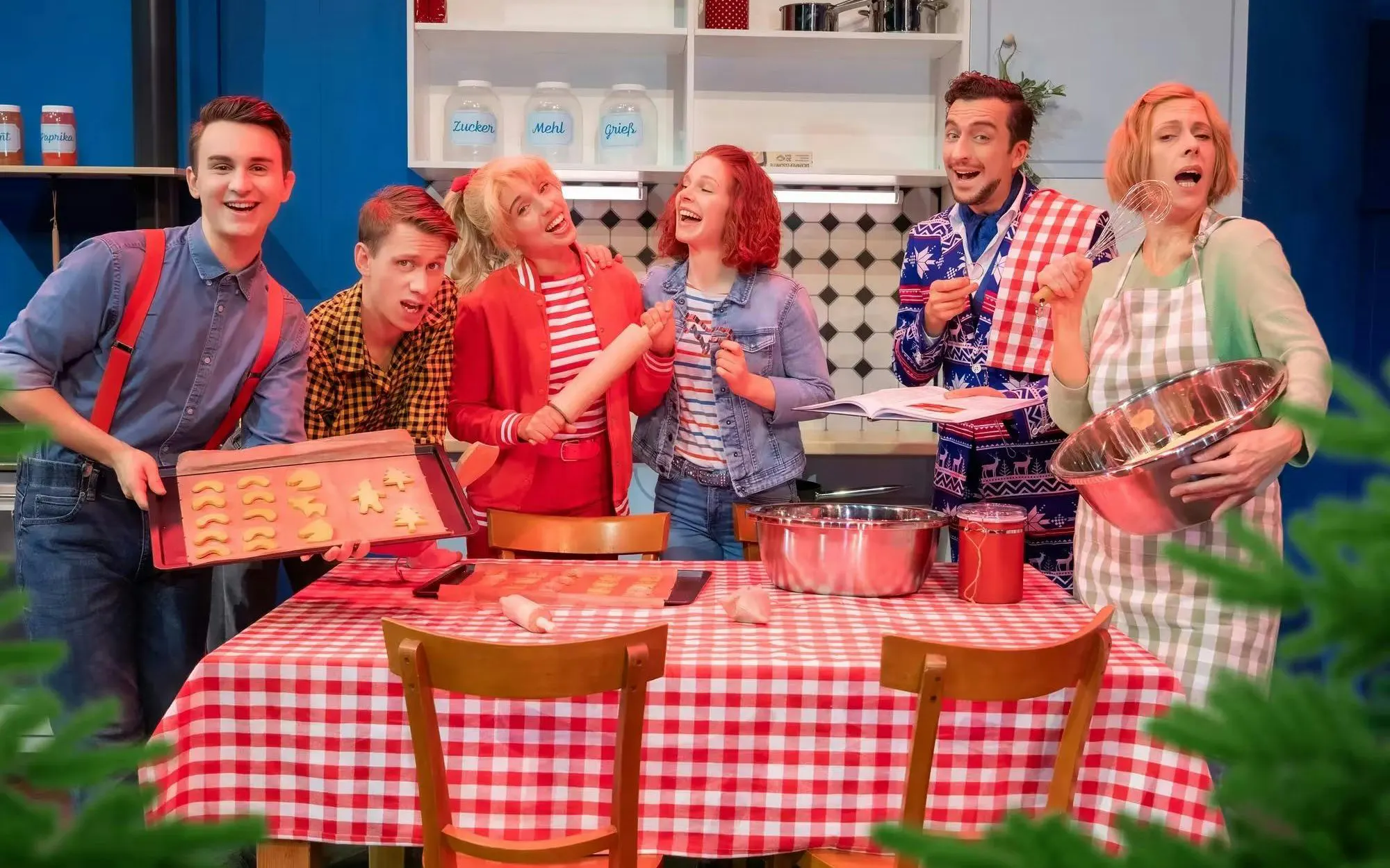 Cast of Bibi & Tina musical baking in a Berlin kitchen scene.