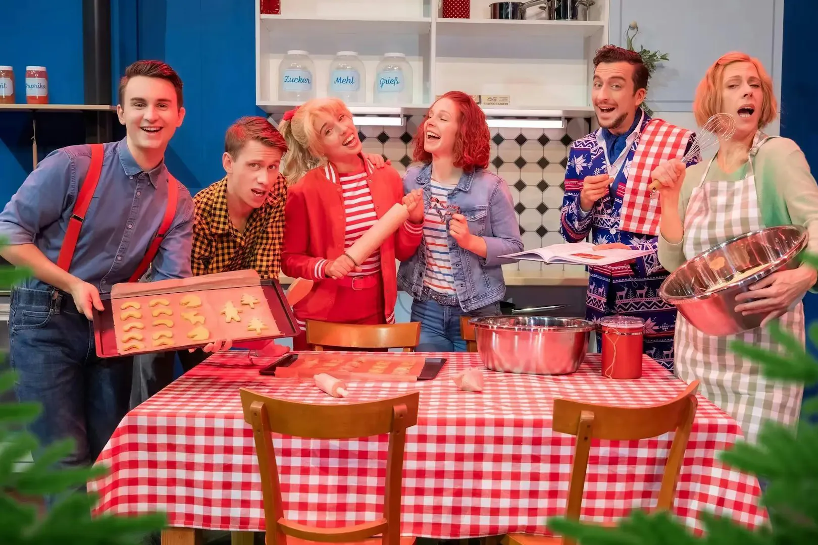 Cast of Bibi & Tina musical baking in a Berlin kitchen scene.