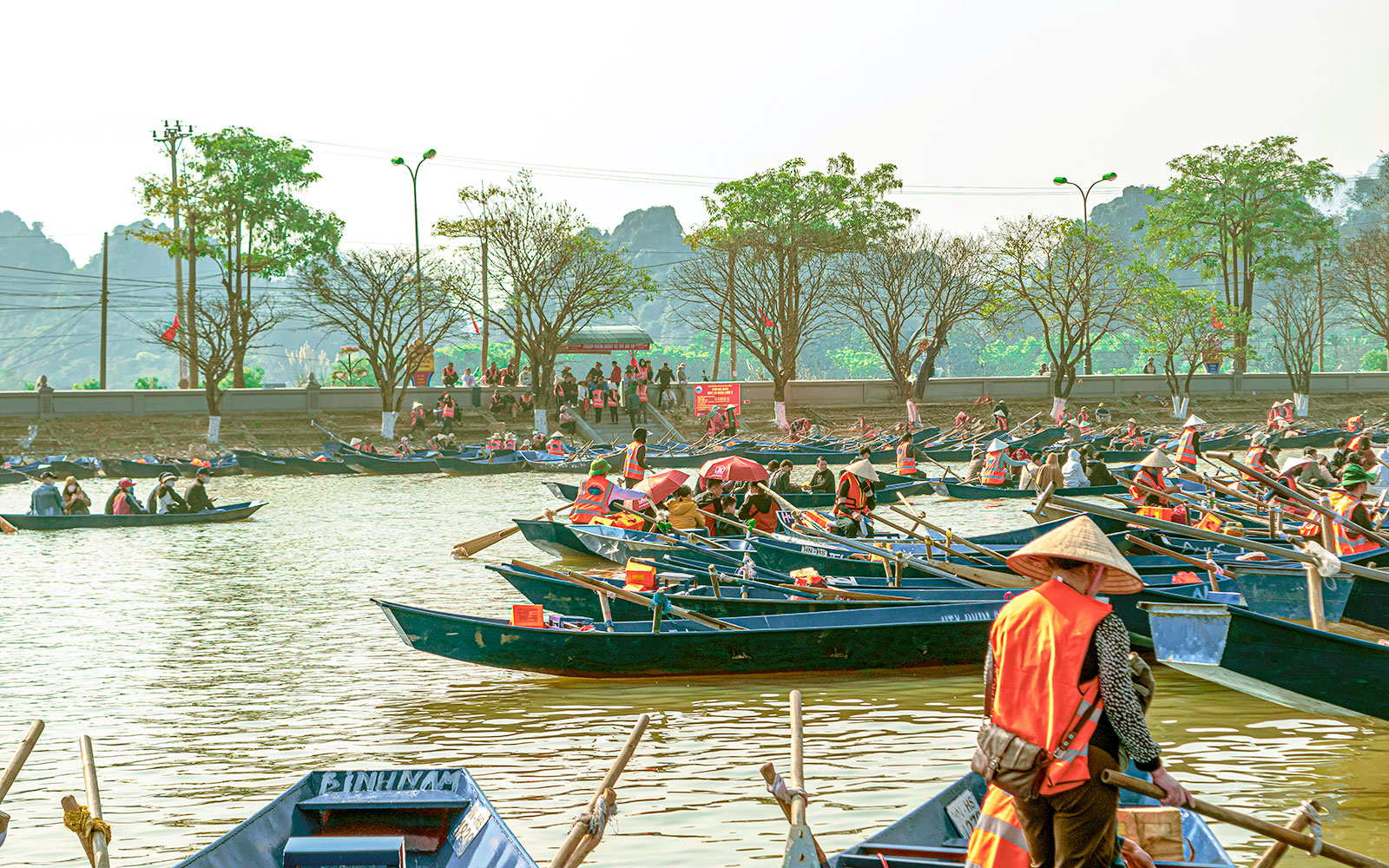 Tourists in bamboo basket boats on a river in Hoi An, Vietnam.