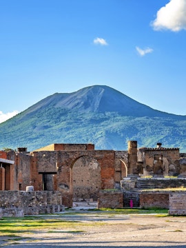 Ancient ruins with Mount Vesuvius in the background, Pompeii, Campania, Italy.