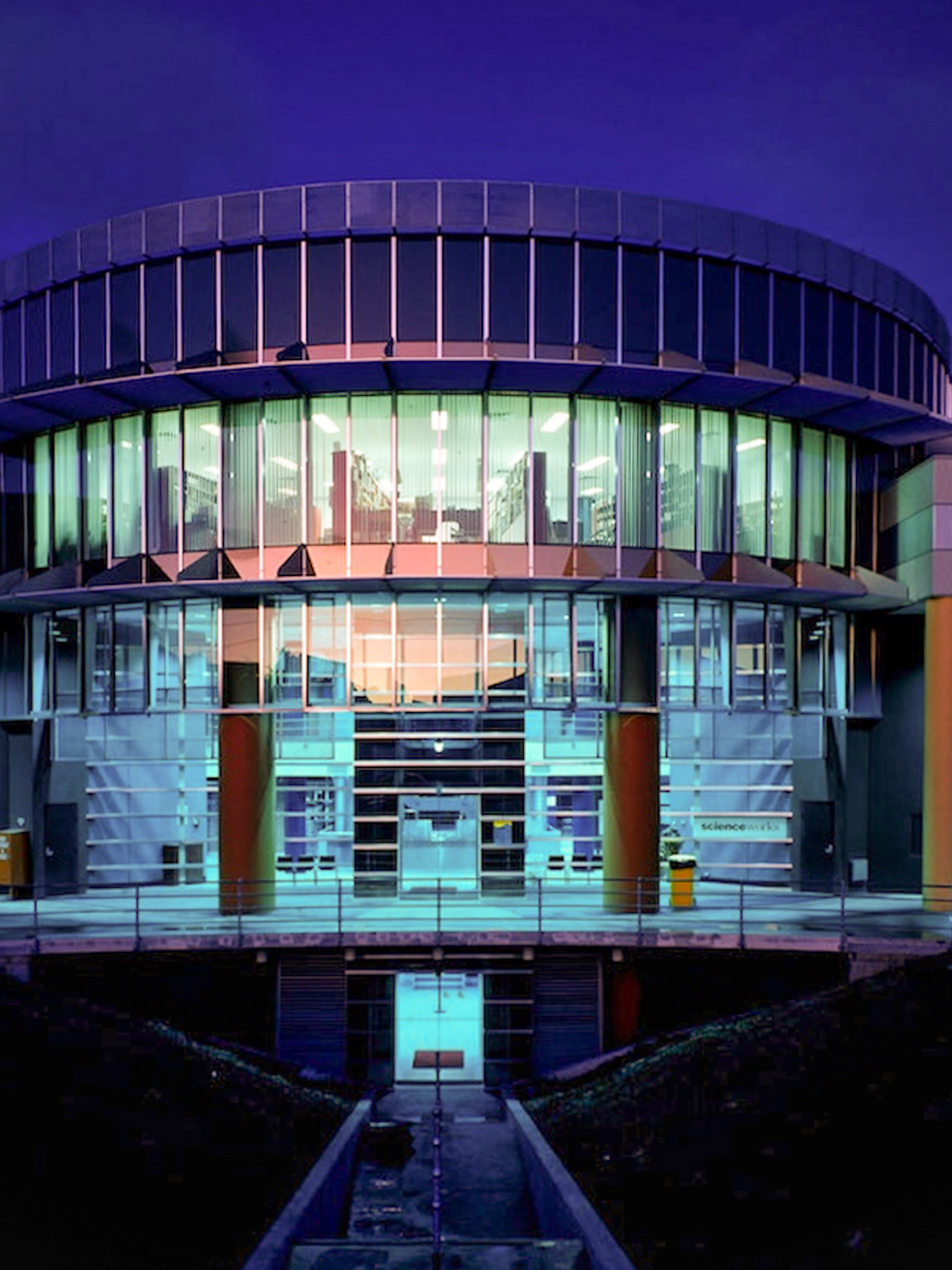 Exterior of Scienceworks Museum illuminated at night.