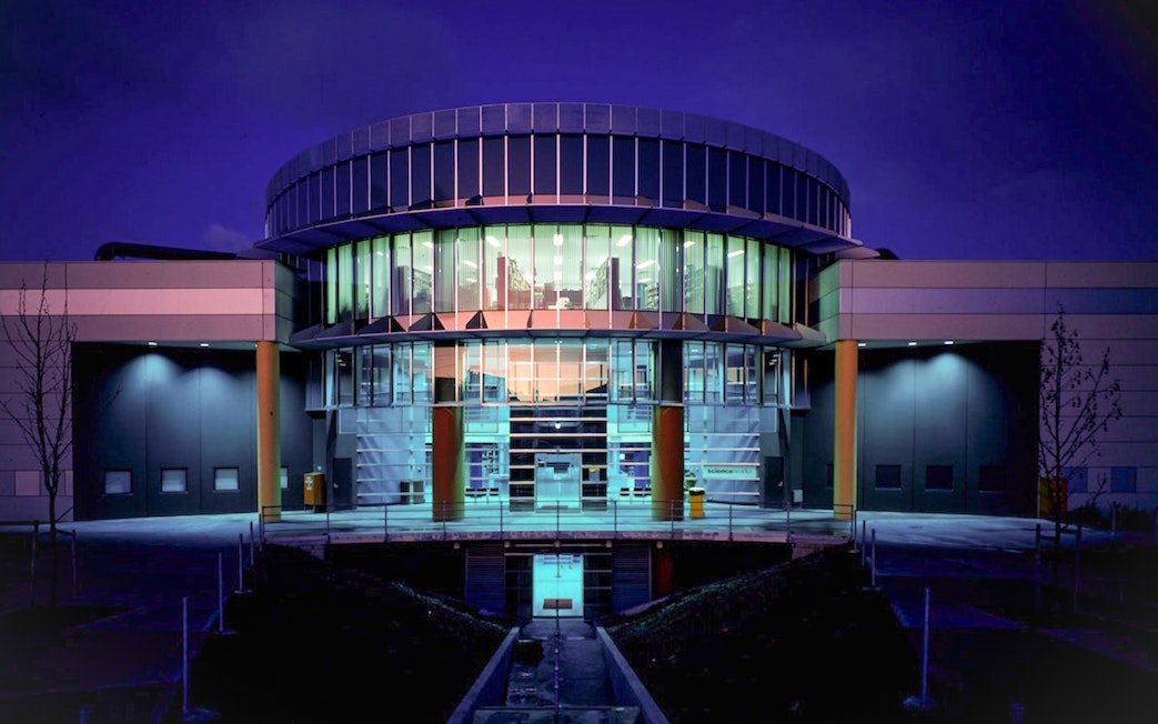 Exterior of Scienceworks Museum illuminated at night.