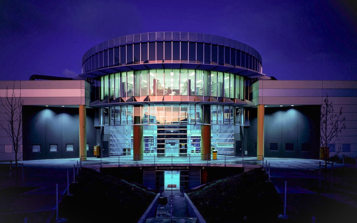 Exterior of Scienceworks Museum illuminated at night.
