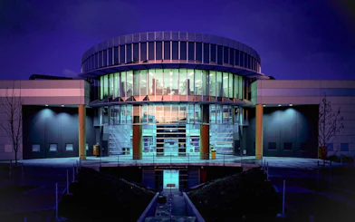 Exterior of Scienceworks Museum illuminated at night.
