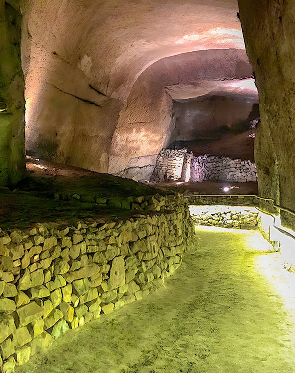 Underground stone passageway at Lapis Museum, illuminated with soft lighting.