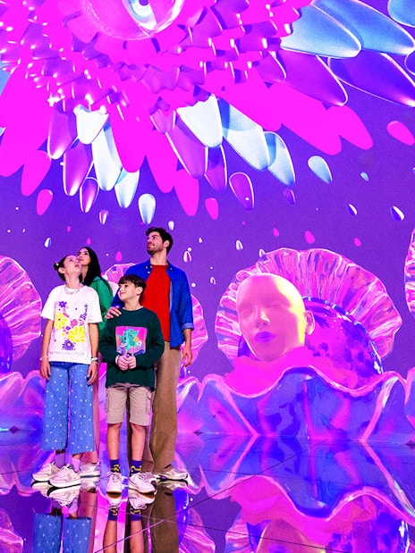 Tourists exploring vibrant digital art installation at House of Hype, Dubai.