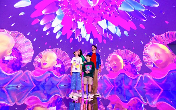 Tourists exploring vibrant digital art installation at House of Hype, Dubai.