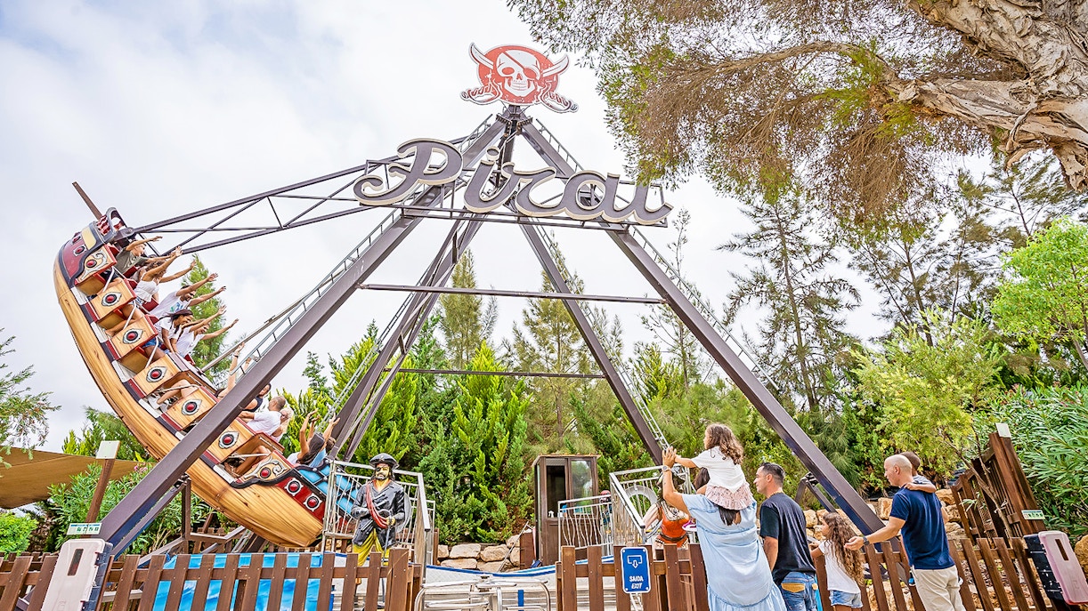 Dolphin show at Zoomarine Water Park, Albufeira, Portugal, with audience enjoying 1-day tickets.