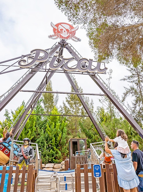 Pirate ship ride at Zoomarine Water Park with visitors enjoying the swing.