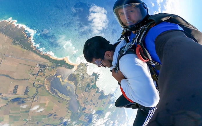 Tandem skydive over Great Ocean Road coastline near 12 Apostles, Australia.