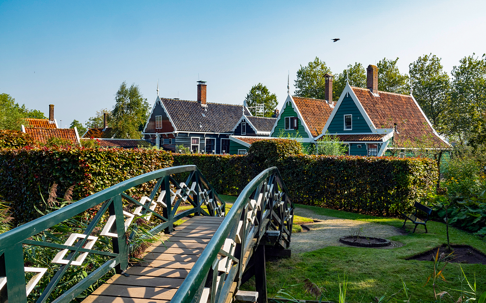 Bridge leading to traditional Dutch houses in Zaanse Schans, Netherlands.