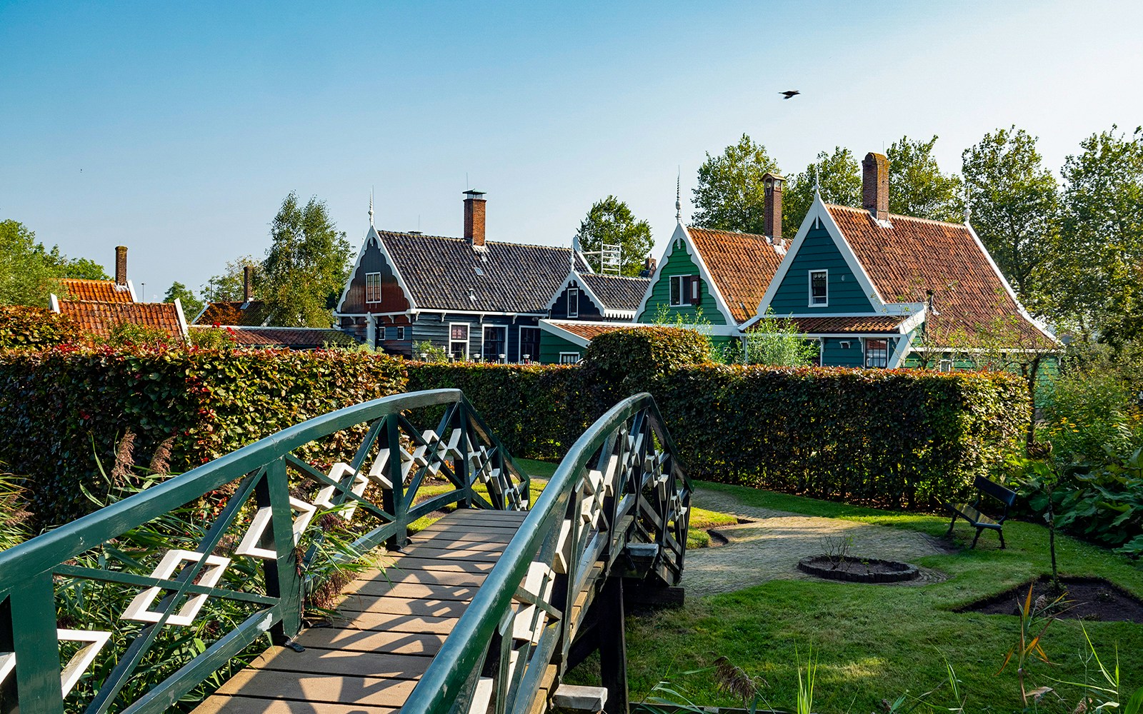Bridge leading to traditional Dutch houses in Zaanse Schans, Netherlands.