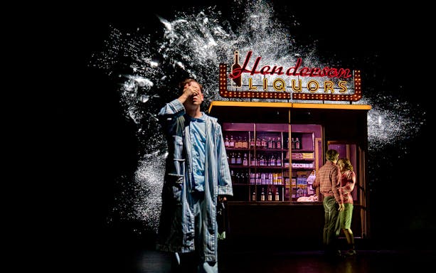 Man in pajamas near Henderson Liquors sign, couple embracing, Stranger Things: The First Shadow.
