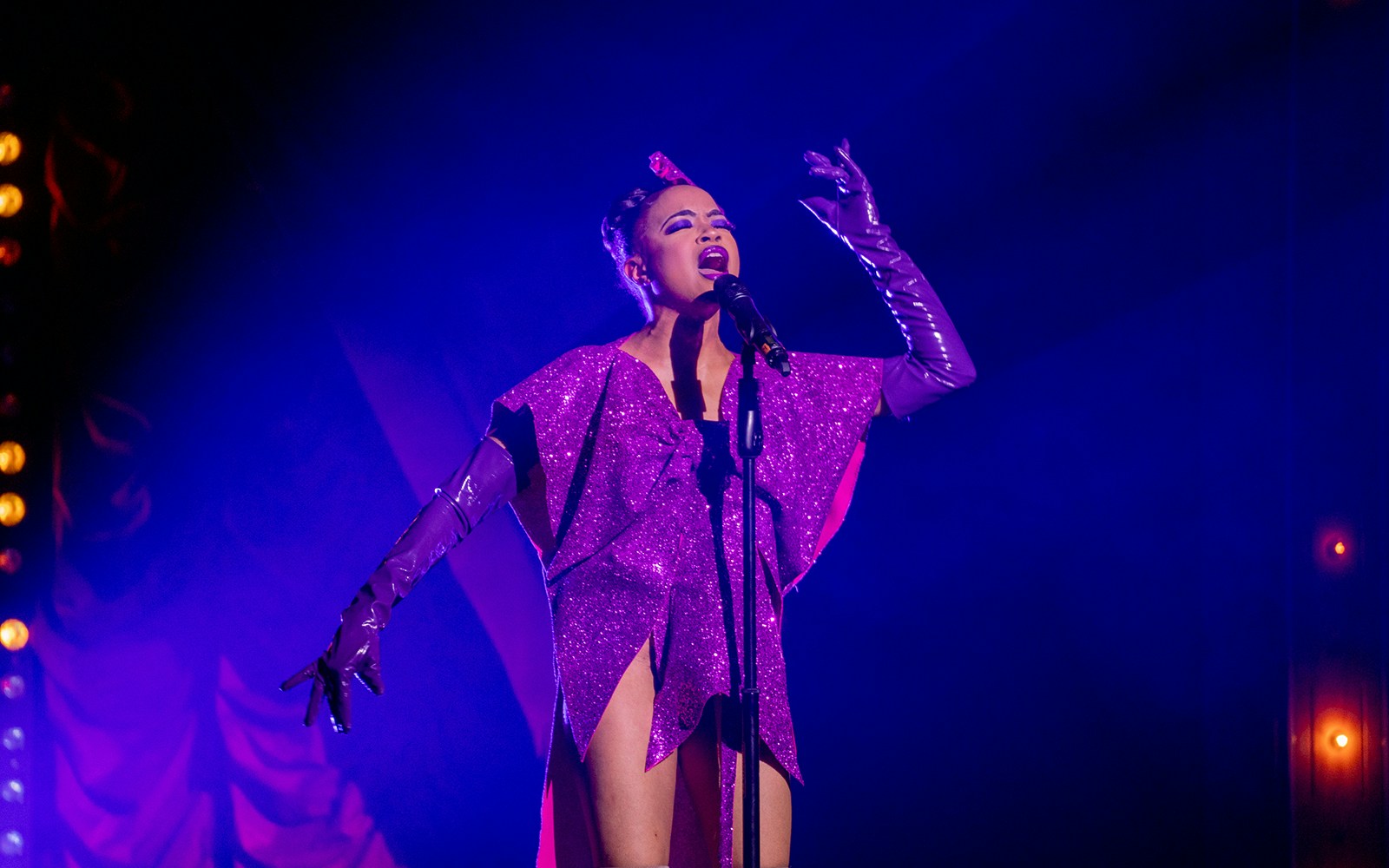 Performers on stage at La Clique show in London, featuring acrobatics and cabaret acts.
