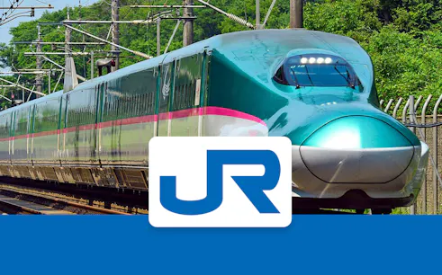 High-speed train on JR East Tohoku line with JR logo.