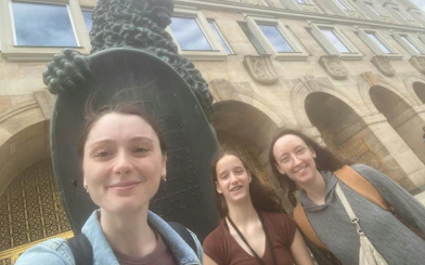 Visitors in front of a historic building in Dresden during the Royal Ghost of August the Strong city exploration game.
