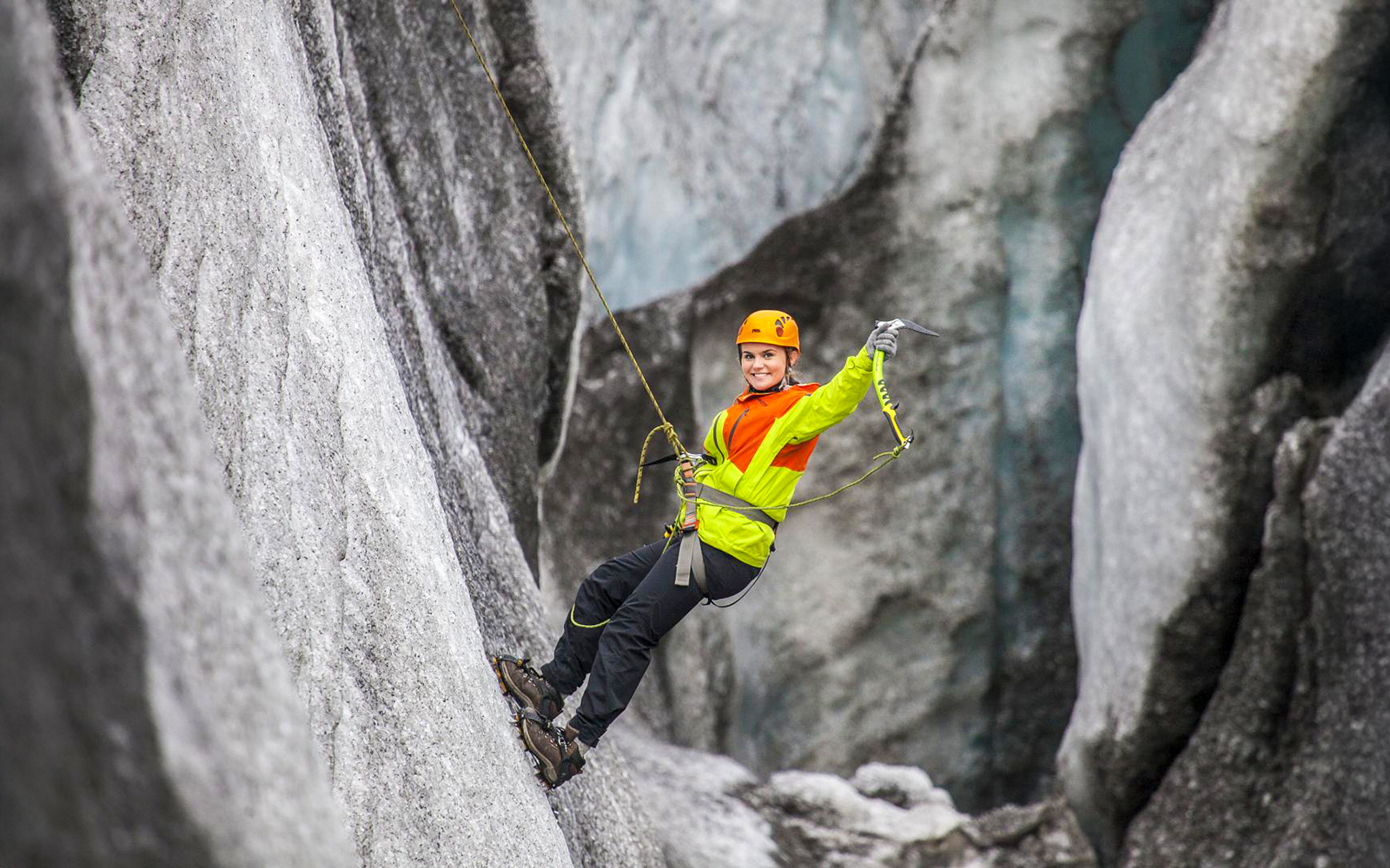 Guest ice climbing on a glacier in Skaftafell, Iceland.