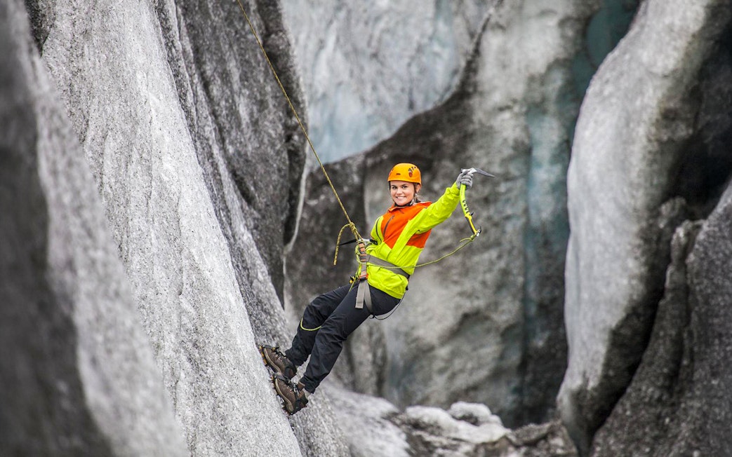 Guest ice climbing on a glacier in Skaftafell, Iceland.