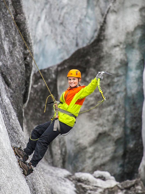 Guest ice climbing on a glacier in Skaftafell, Iceland.
