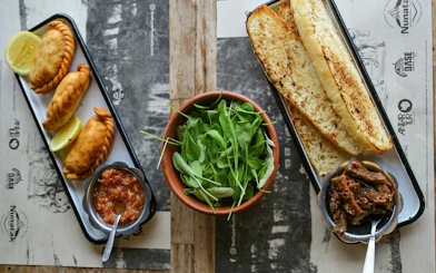 Empanadas, grilled bread, and salad served during Snow and Fire Night experience.