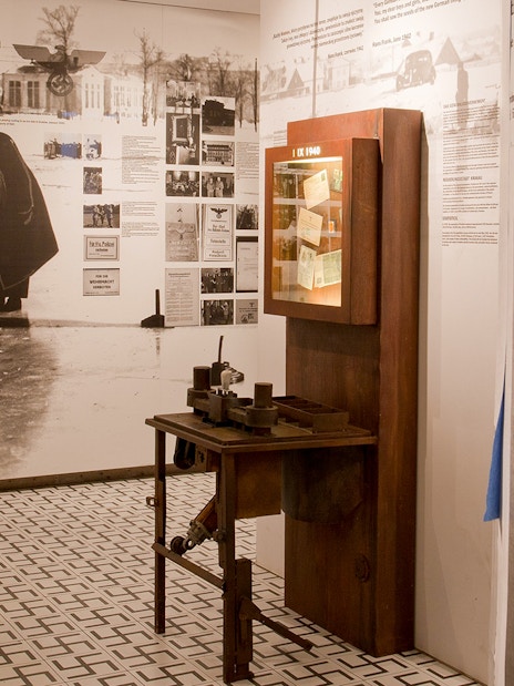 Exhibit at Oskar Schindler’s Factory with historical photos and artifacts.
