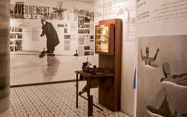 Exhibit at Oskar Schindler’s Factory with historical photos and artifacts.